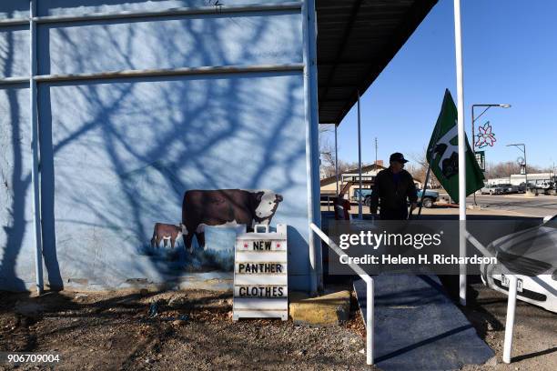 Bill Hume, owner of Nichols Store, comes outside to help a customer get out of her car at his store on December 5, 2017 in Rangely, Colorado. Nichols...