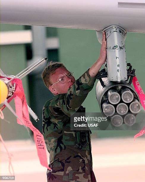 Crew Chief Airman Brandon Kunc performs a pre-flight inspection on an A-10 Thunderbolt II arriving from Aviano Air Base, Italy April 12, 1999. Kunc...