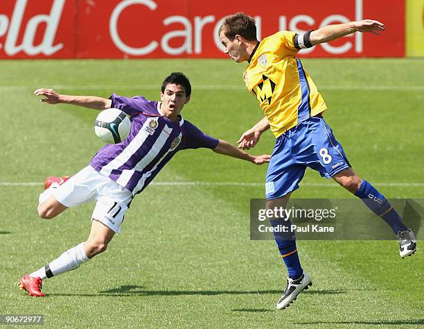 Ryan Edwards of the Glory and Steven Lustica of Gold Coast contest the ball during the round one National Youth League match between the Perth Glory...