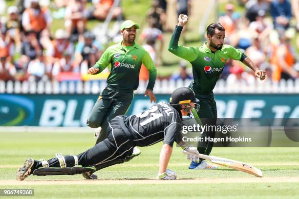 Faheem Ashraf of Pakistan attempts to run out Martin Guptill of New Zealand during game five of the One Day International Series between New Zealand...