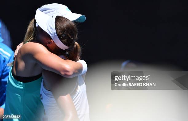 Czech Republic's Denisa Allertova hugs Poland's Magda Linette after their women's singles third round match on day five of the Australian Open tennis...
