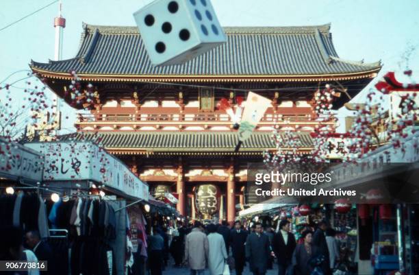 People on a market vis-a-vis the Asakusa temple at Tokyo, Japan 1960s.