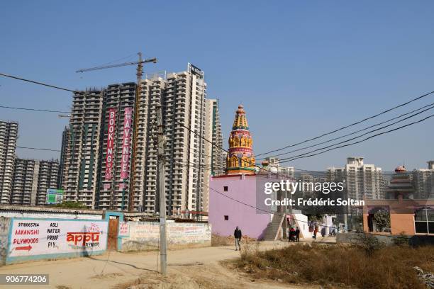 Old village on the construction site in Noida, short for the New Okhla Industrial Development Authority. It is an extension of Delhi, the capital of...