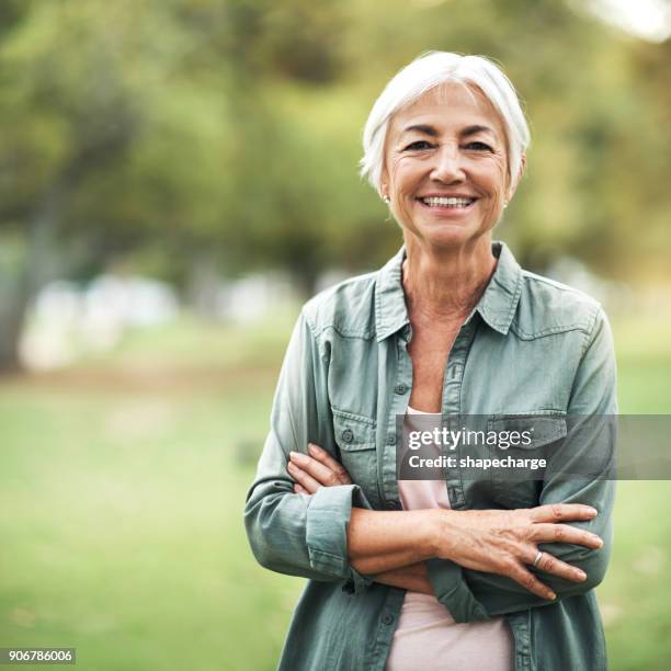 living life as positively as i can - mature adult portrait stock pictures, royalty-free photos & images