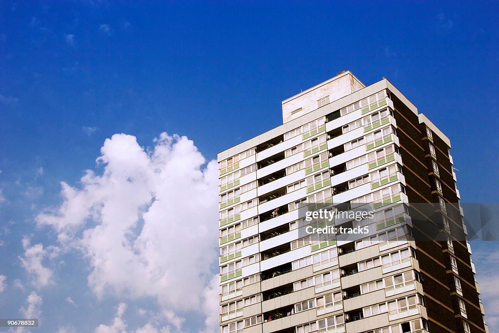London inner city block of flats, blue sky and clouds
