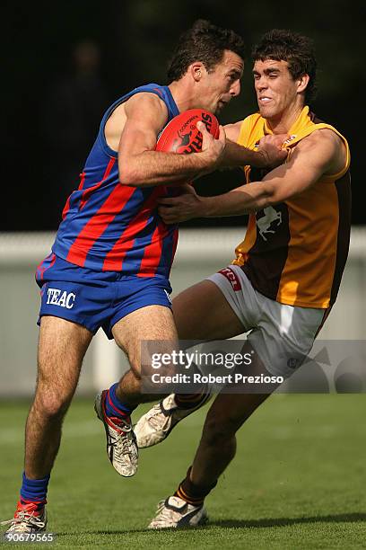 Brendan Neville of Port Melbourne breaks a tackle during the VFL Semi Final match between Port Melbourne and the Box Hill Hawks at Teac Oval on...