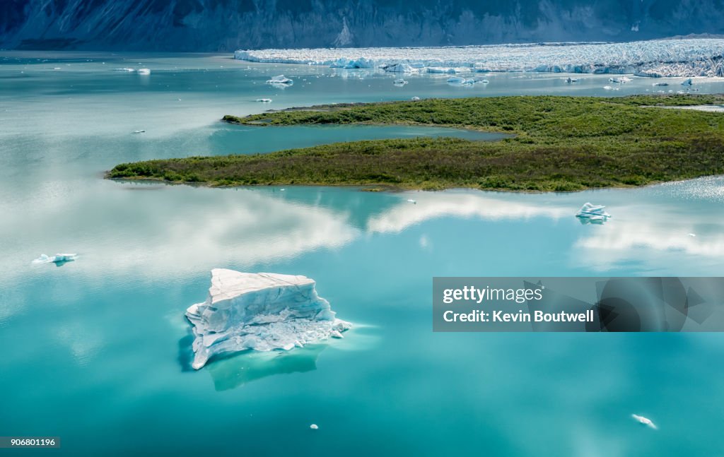 Aerial view of an iceberg floating in a glacial lake in Alaska