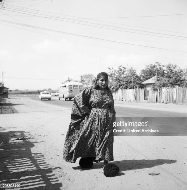 Indigenous women of Goajira walks down the street near or in Maracaibo, Venezuela 1966.