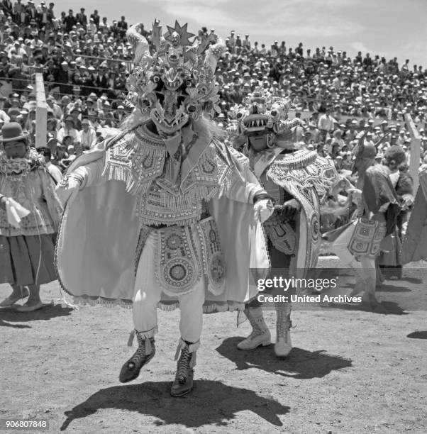 Carnival in Peru - disguised folks celebrating the Candelaria at Puno, Peru 1960s.