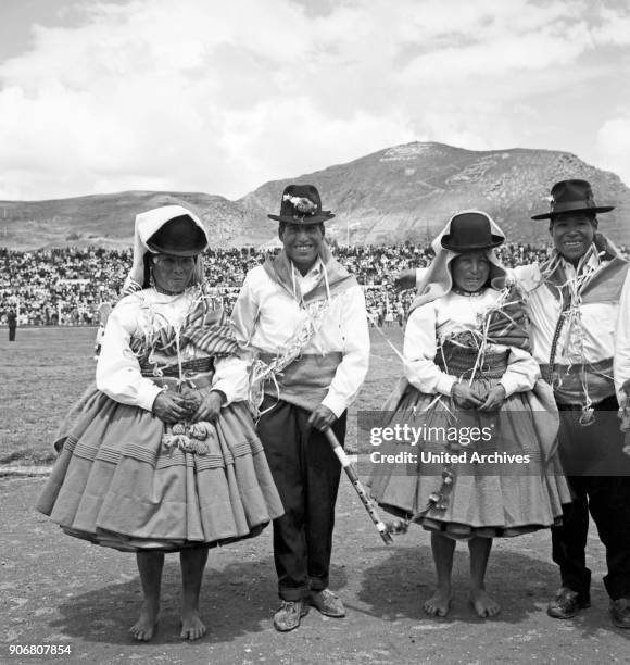 Carnival in Peru - disguised folks celebrating the Candelaria at Puno, Peru 1960s.