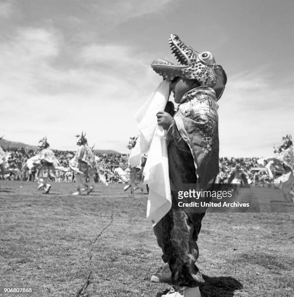 Carnival in Peru - disguised folks celebrating the Candelaria at Puno, Peru 1960s.