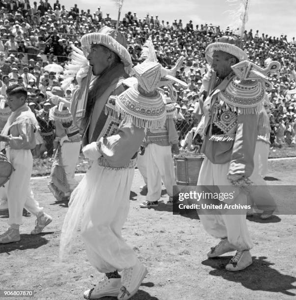 Carnival in Peru - disguised folks celebrating the Candelaria at Puno, Peru 1960s.