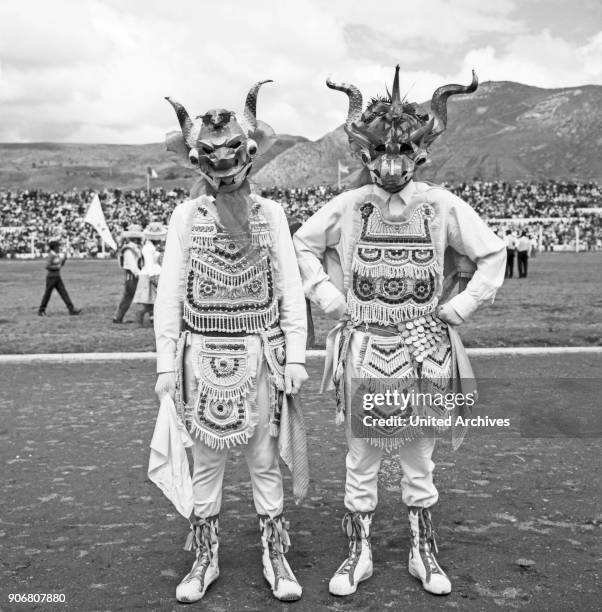 Carnival in Peru - disguised folks celebrating the Candelaria at Puno, Peru 1960s.