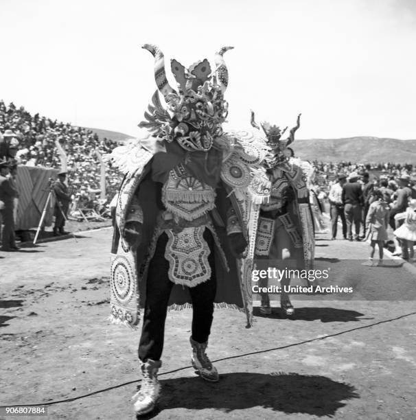 Carnival in Peru - disguised folks celebrating the Candelaria at Puno, Peru 1960s.