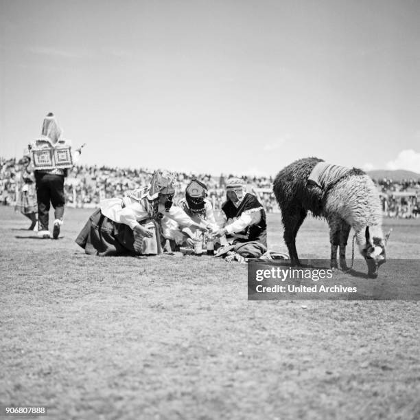 Carnival in Peru - disguised folks celebrating the Candelaria at Puno, Peru 1960s.