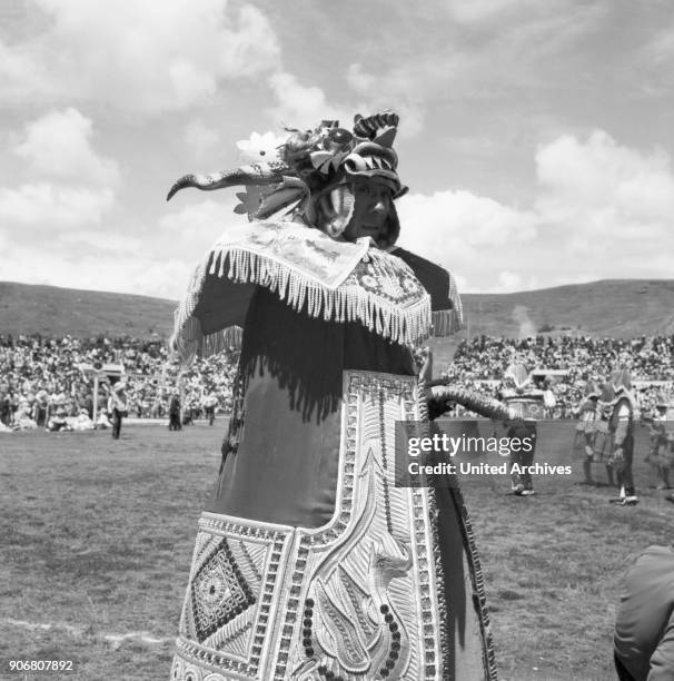 Carnival in Peru - disguised folks celebrating the Candelaria at Puno, Peru 1960s.