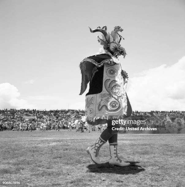 Carnival in Peru - disguised folks celebrating the Candelaria at Puno, Peru 1960s.