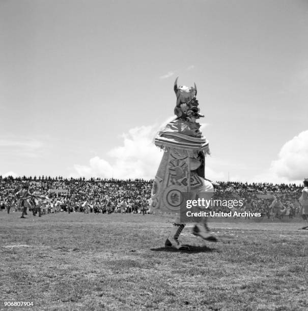 Carnival in Peru - disguised folks celebrating the Candelaria at Puno, Peru 1960s.