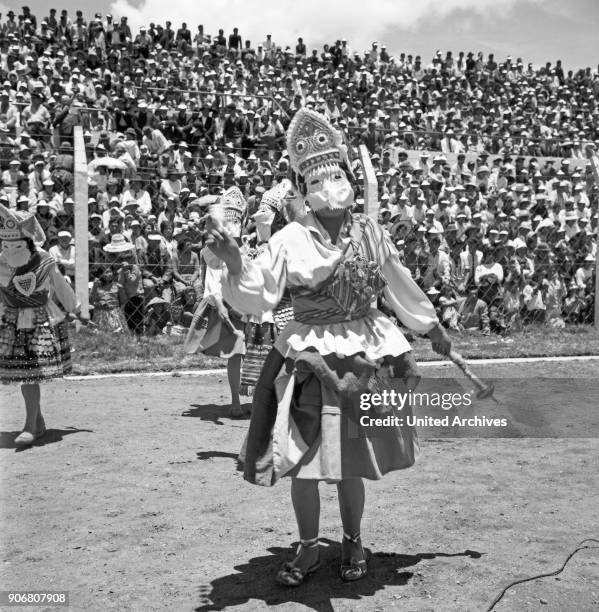 Carnival in Peru - disguised folks celebrating the Candelaria at Puno, Peru 1960s.