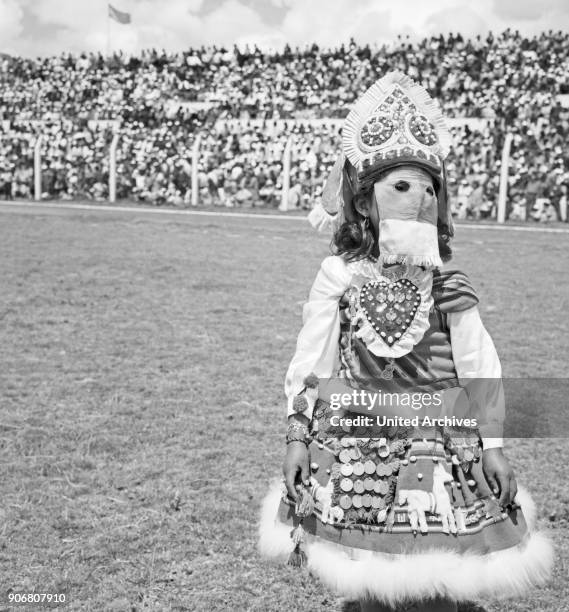 Carnival in Peru - disguised folks celebrating the Candelaria at Puno, Peru 1960s.