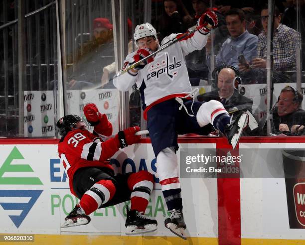 Tom Wilson of the Washington Capitals and Brian Gibbons of the New Jersey Devils collide in the second period on January 18, 2018 at Prudential...