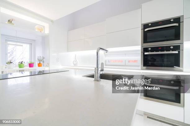 fresh and modern white style home kitchen interior - quartz kitchen stock pictures, royalty-free photos & images