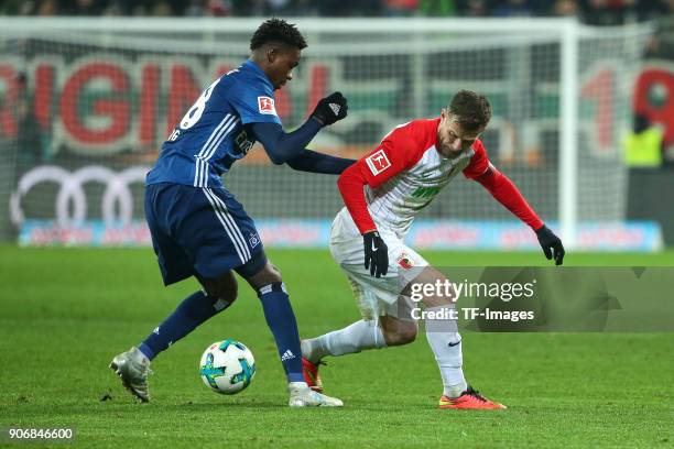 Gideon Jung of Hamburg and Daniel Baier of Augsburg battle for the ball during the Bundesliga match between FC Augsburg and Hamburger SV at WWK-Arena...