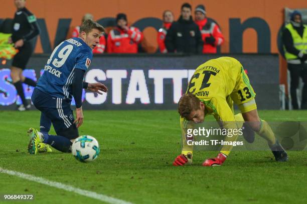 Sven Schipplock of Hamburg and Goalkeeper Julian Pollersbeck of Hamburg on the ground during the Bundesliga match between FC Augsburg and Hamburger...