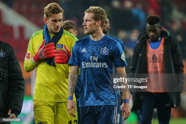 Goalkeeper Julian Pollersbeck of Hamburg and Andre Hahn of Hamburg look dejected after the Bundesliga match between FC Augsburg and Hamburger SV at...