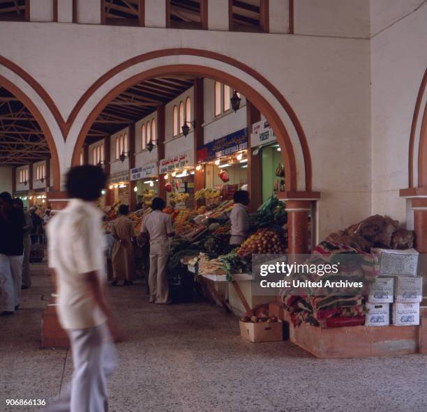 Shopping in the market halls of Sharjah, United Arab Emirates 1970s.