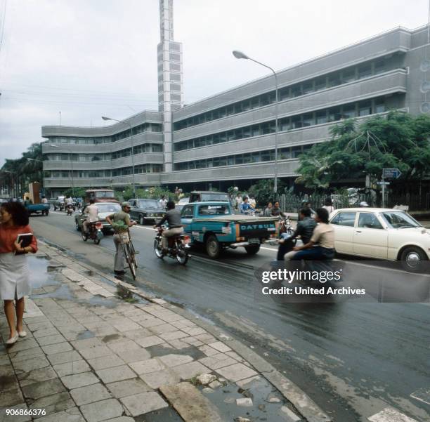 Traffic in front of the Savoy Homann Hotel of Bandung on the island of Java, Indonesia 1980s.