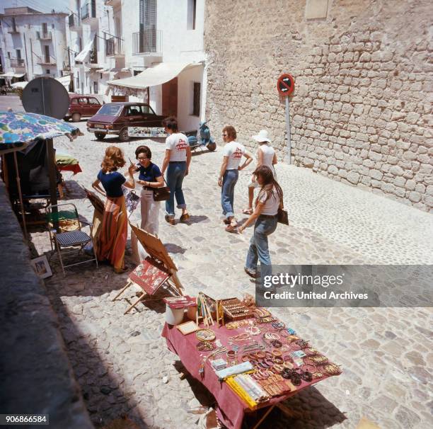 Shopping at a hippie market in the city of Ibiza, Ibiza 1976.