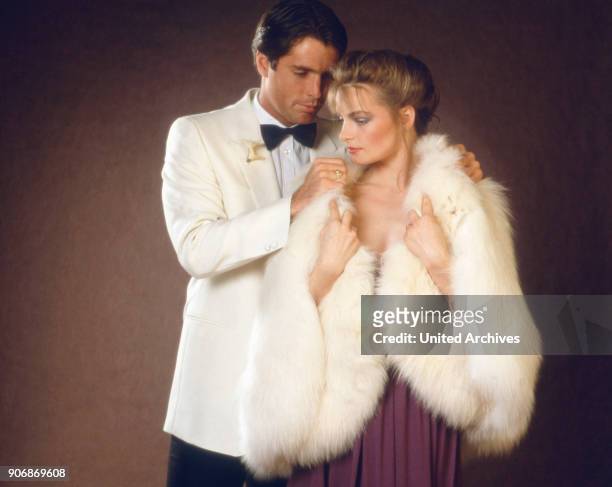 Couple in evening dress, 1980s.