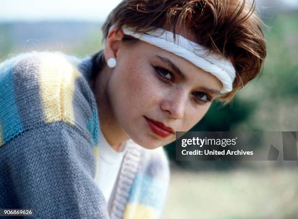 Woman with headband, 1980s.