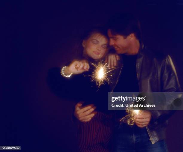 Couple with miracle candles, 1980s.