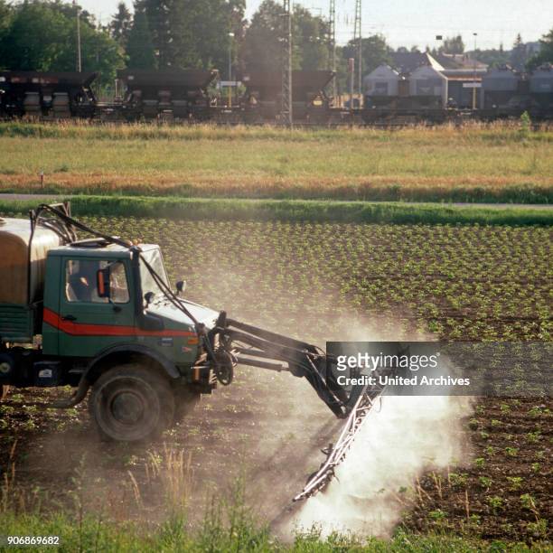 Fertilizing a field with an Unimog, Germany 1980s.