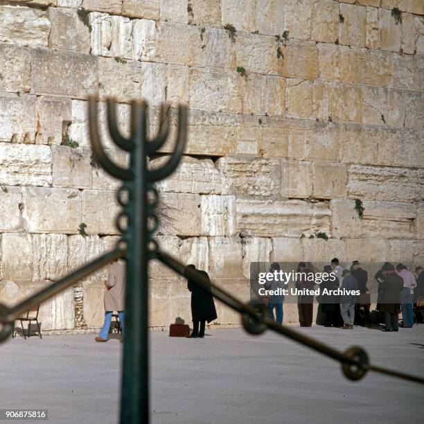 Tourists and orthodox jews at the wailing wall of Jerusalem, Israel late 1970s.
