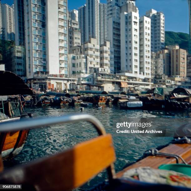 Houseboats and modern skyscrapers at Hong Kong's Aberdeen quarter, early 1980s.