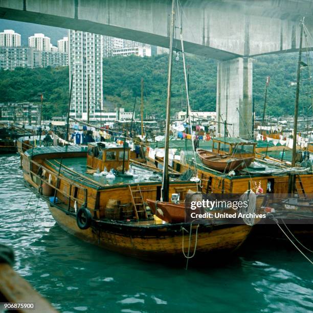 Boats anchoring near a bridge at Hong Kong harbor, early 1980s.