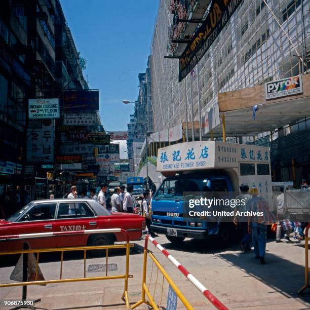 Street scene at Hyatt Hotel while being under construction at Hong Kong, early 1980s.