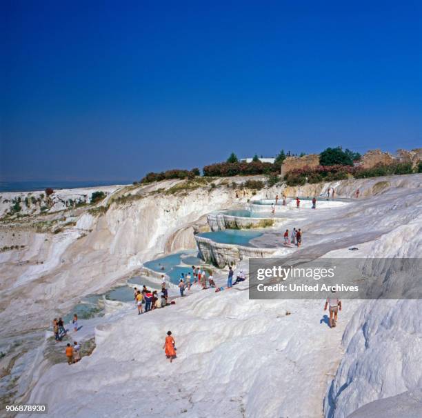 Tourists visiting the lily ponds at Pamukkale, Turkey 1980s.