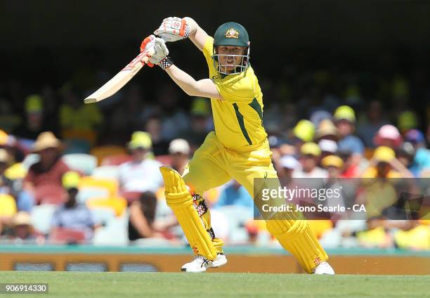 Australian batsman David Warner hits a boundary during game two of the One Day International series between Australia and England at The Gabba on...