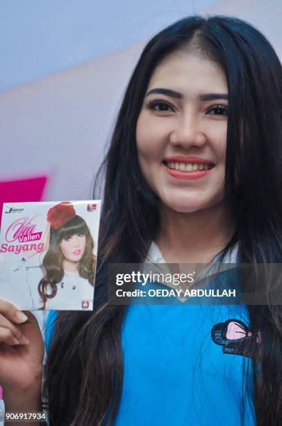 This picture taken on January 18, 2018 shows Indonesian singer Via Vallen posing during the launch of her new album in Jakarta. / AFP PHOTO / OEDAY...