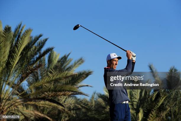 Ross Fisher of England plays his shot from the 14th tee during round two of the Abu Dhabi HSBC Golf Championship at Abu Dhabi Golf Club on January...