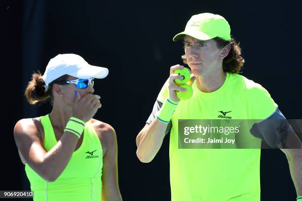 Anastasia Rodionova of Australia and John-Patrick Smith of Australia talk tactics in their first round mixed doubles match against Vania King of the...