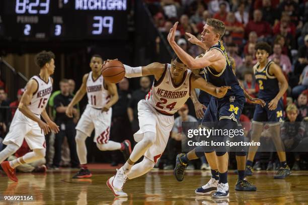 Nebraska guard James Palmer Jr. Drives into Michigan forward Moritz Wagner during the second half of a college basketball game Thursday, January 18th...