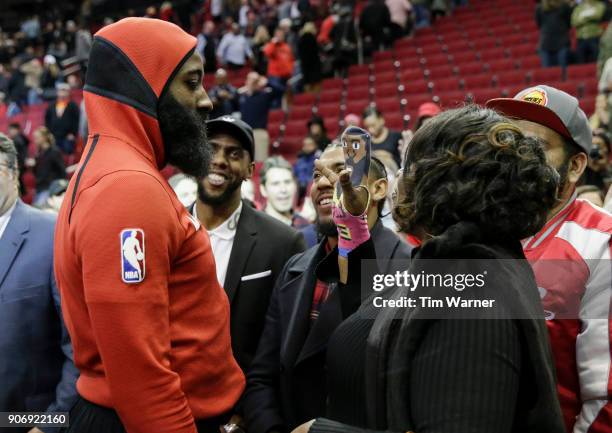 Monja Willis greets her son James Harden of the Houston Rockets after the game with an official James Harden Cheer Puppet after the game against the...