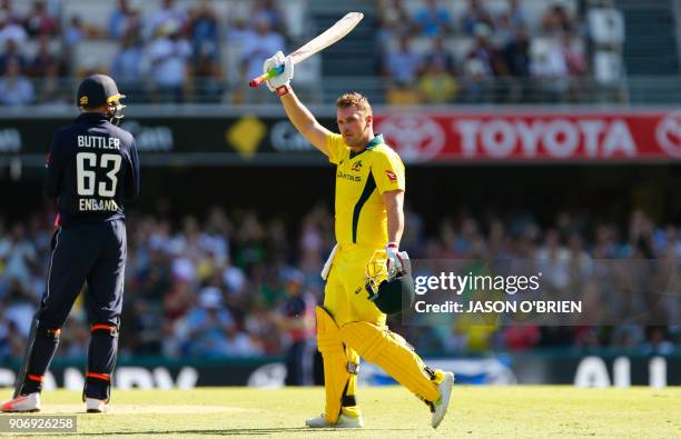 Australia's Aaron Finch celebrates his century during the 2nd one-day international cricket match between England and Australia in Brisbane on...