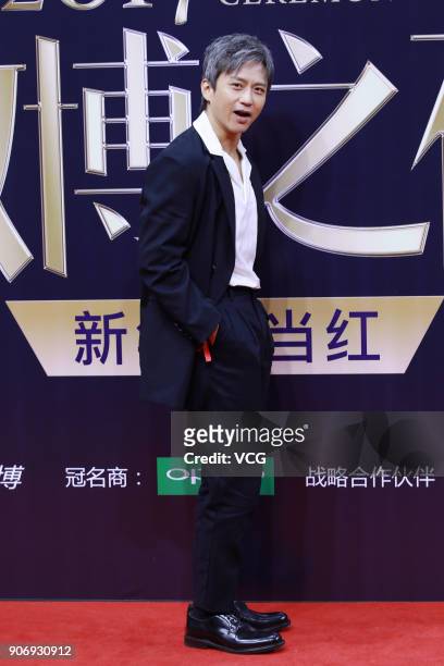 Actor Deng Chao poses on the red carpet of 2017 Weibo Awards Ceremony at National Aquatics Center on January 18, 2018 in Beijing, China.
