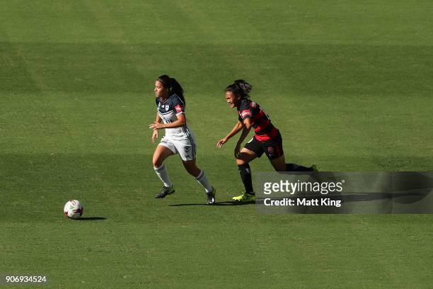 Angela Beard of the Victory is challenged by Rasamee Phonsongkham of the Wanderers during the round 12 W-League match between the Western Sydney...